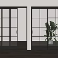 Modern Black Framed Glass Sliding Doors in Bright Interior with Plants