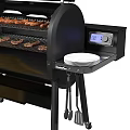 Black Outdoor Grill With Digital Display Grilled Food Yellow Bag And Tools