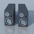 Sleek Modern Black Speakers With Silver Knobs Circular Drivers And Reflections