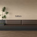 Poliform Brown Banquette Sofa With Green Plant Beige Wall And Wooden Floor