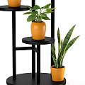 Modern Multi tiered Black Plant Stand With Orange Pots And Green Potted Plants