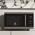 Electrolux Microwave Oven On Kitchen Shelf With Marble Countertop And Books