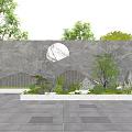 Natural Stone Feature Wall with Circular Design Surrounded by Trees and Paved Plaza under Blue Sky