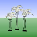 Elegant White Orchids in Tall Metal Vases Against Dark Wall and Wooden Floor