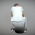Man Sitting In Gray Sweatpants White T-Shirt Wearing Watch Holding Thermal Cup On Gray Background