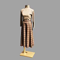 Fashion Model in Beige Turtleneck Top and Plaid Midi Skirt on Yellow Base