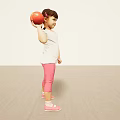 Young woman in white T-shirt and pink leggings holding red ball on light floor