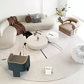 Curved Sofa Coffee Table Combination With Accent Armchair Decorative Pillows Throw Blanket And Green Plant