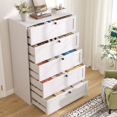 White Chest of Drawers with Open Drawers Colorful Items Near Green Chair and Plant 3d model