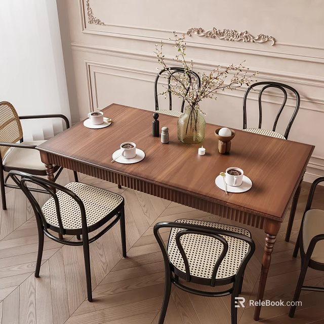 Wooden Dining Table With Black Frame Wicker Seat Chairs Tea Cups Saucers And Flower Vase 3d model 