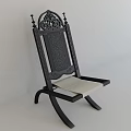 Black Wooden Leisure Chair With Intricate Carved Design And Light Colored Cushion