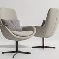 Modern Lounge Chairs with Curved Beige Upholstery Gray Cushions and Black Metal Star Bases