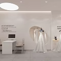 Bridal Shop Interior With White Wedding Dresses On Mannequins And Archways