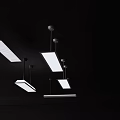 Modern Multiple Long Rectangular White Pendant Lights Hanging From Black Ceiling 3d model