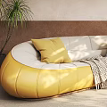 Stylish Yellow Curved Sectional Sofa With Yellow And Striped Cushions Green Plant And Floor Lamp