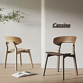 Modern Wooden Dining Chairs With Curved Back By Cassina In Minimalist Interior With Green Plant
