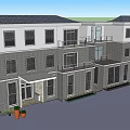Modern Single Family House Exterior With Gray Facade Large Windows And Red Flowers