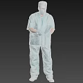 A Man in Blue Surgical Scrubs Wearing Surgical Cap Mask and Blue Gloves Standing