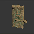 Ornate Bronze Door Handle With Intricate Facial Carvings And Decorative Patterns