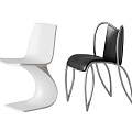 Sleek Modern Dining Chairs In White And Black With Curved Lines And Metal Legs