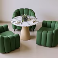 Modern Green Chairs And Round Marble Table Set With Beige Base And Decorative Flowers