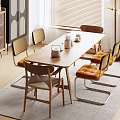 Modern Wooden Dining Table Set With Rattan Back Chairs Yellow Cushions And Potted Plant