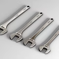 Professional Hardware Tools Shiny Steel Adjustable Wrenches Four Pieces Neatly Placed on Grey Surface