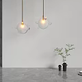 Modern Bubble Decor Glass Sphere Pendant Lights Hanging Against White Wall With Visible Bulbs
