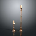 Elegant Golden Candle Holders With Tall And Short Designs On Black Background