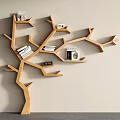 Tree Shaped Wooden Bookshelf With Multiple Branches Holding Books And Decorative Items