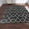 Square Rug With Black And White Geometric Pattern On Wooden Floor For Modern Home Decor