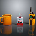 Red River Weapon Gear Display With Orange Mug And Yellow Walkie Talkie