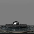Tranquil Courtyard Garden Featuring Ornamental Spherical Ball Fountain With Flowing Water And Lush Greenery