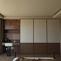 Modern Wooden Wardrobe With White Brown Panels And Drawer Storage In Bedroom Interior