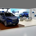 Modern Exhibition Booth Displaying Two Blue Cars With Backdrop And Chairs