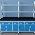 Functional Work Desk With Blue Cabinets Black Countertop And Metal Shelves