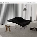 Modern Black Chaise Lounge With Small Wooden Stool Cat On Rug And Floor Lamp