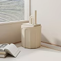 Beige Minimalist Modern Side Table With Fluted Design And Geometric Decor Pieces Near Open Book
