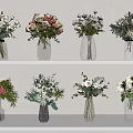 Elegant Flower Arrangements In Transparent Vases With White Pink Blooms And Greenery