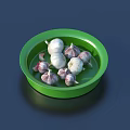 Fresh Garlic Cloves In Green Plate With White And Purple Varieties