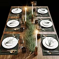 Elegant Tableware Set with White Plates Pine Needles Green Placemats Golden Cutlery Wine Glasses Candles