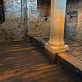 Medieval Interior Featuring Stone Walls Wooden Staircase Pillar And Hardwood Floor