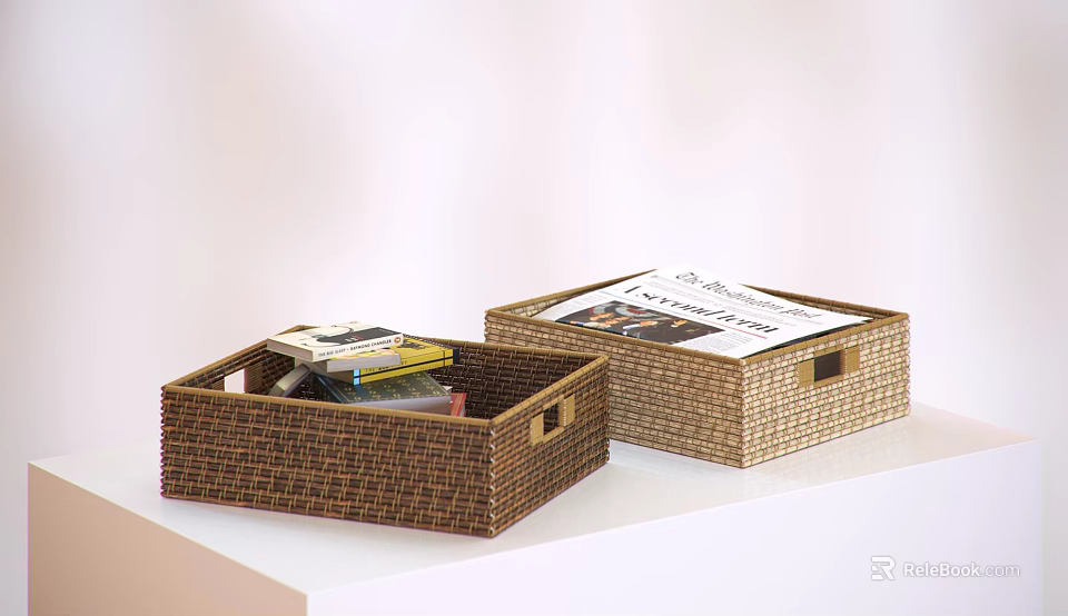 Two Open Wicker Storage Baskets Holding Magazines and Books on White Countertop 3d model 