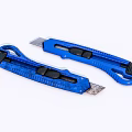 Two Blue Utility Knives With Ergonomic Handles And Retractable Blades