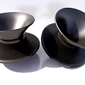 Modern Black Single Chairs With Sleek Smooth Surface And Textured Wave Pattern Bases 3d model