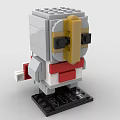 Brick Figure With Gold Gray Head Black Eyes Red White Body Red Cape And Base