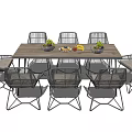 Modern Wooden Dining Table Set With Rattan Chairs And Decorative Fruit Bowls