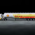White And Yellow Shell Tanker Truck Moving On Road With Trailer