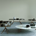 Modern Coffee Tables With Marble Tops And Metal Legs Featuring Decorative Items And Books
