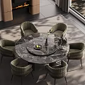 Elegant Restaurant Featuring Round Marble Dining Table With Dark Green Velvet Chairs And Flower Vase